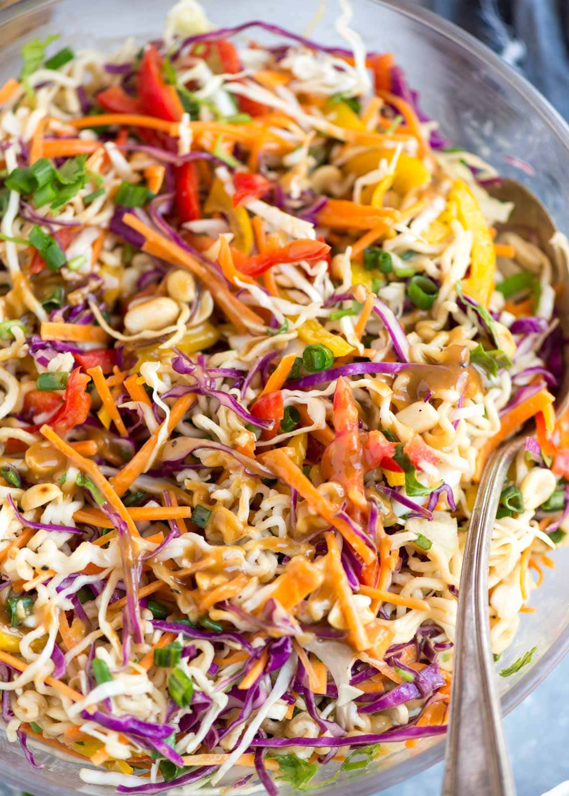 Ramen Noodle Salad with asian peanut dressing after mixed in a bowl.