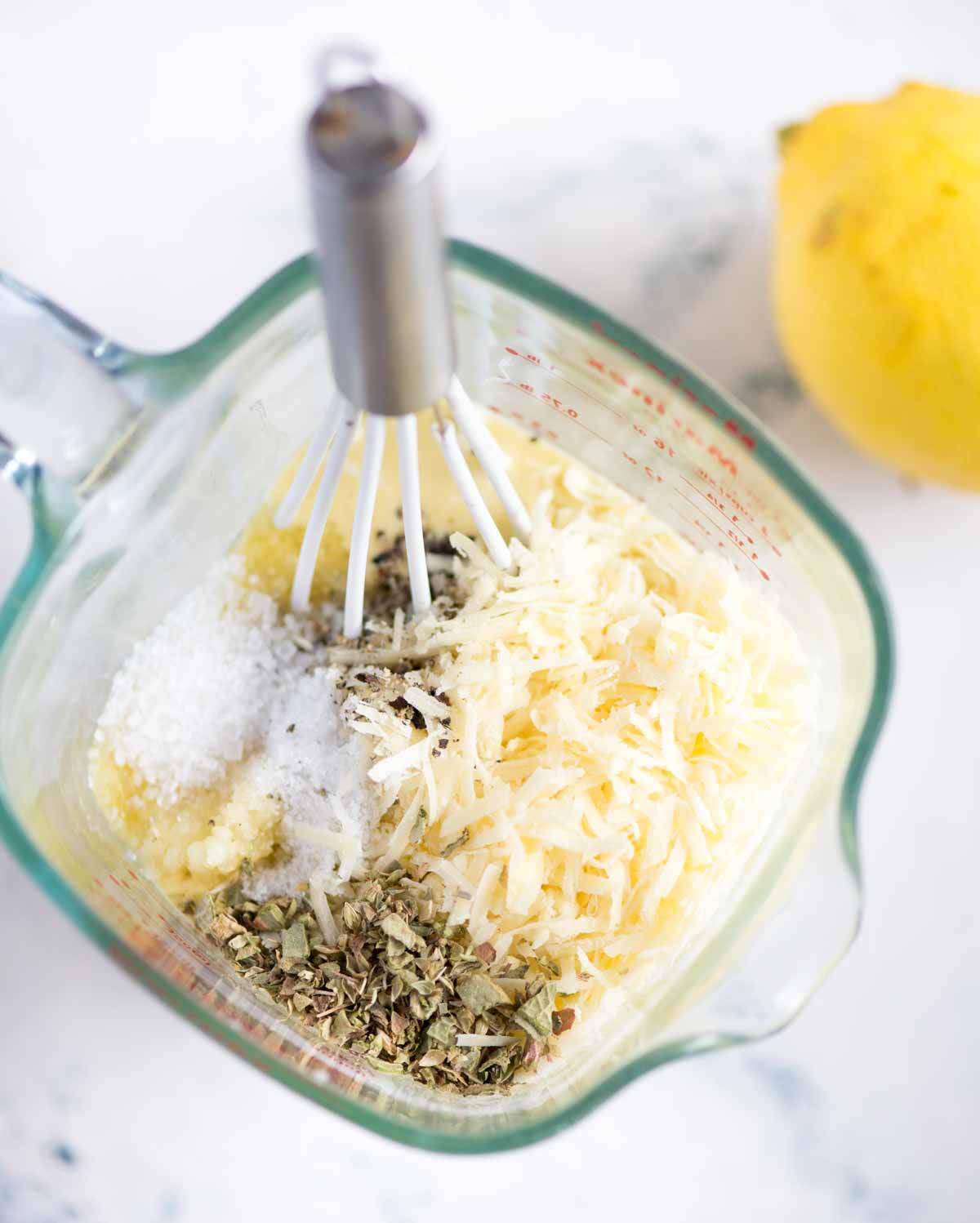 Picture showing whisking step to make parmesan peppercorn dressing