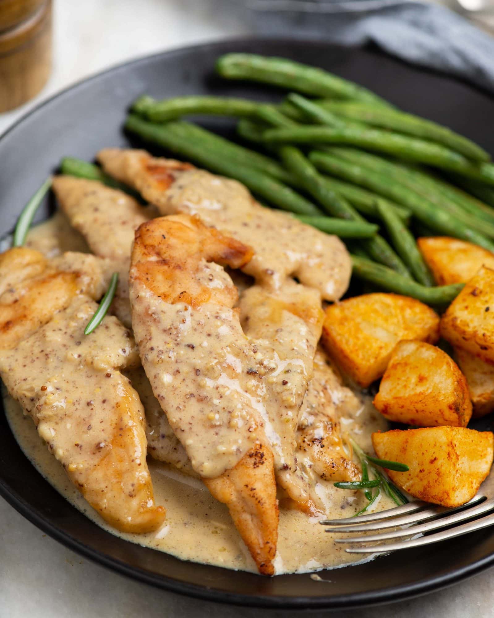 Chicken tenders coated in flour and cooked for a crispy crust. Then simmered in a creamy honey mustard sauce. This is a delicious chicken dinner recipe for the busy working days. 