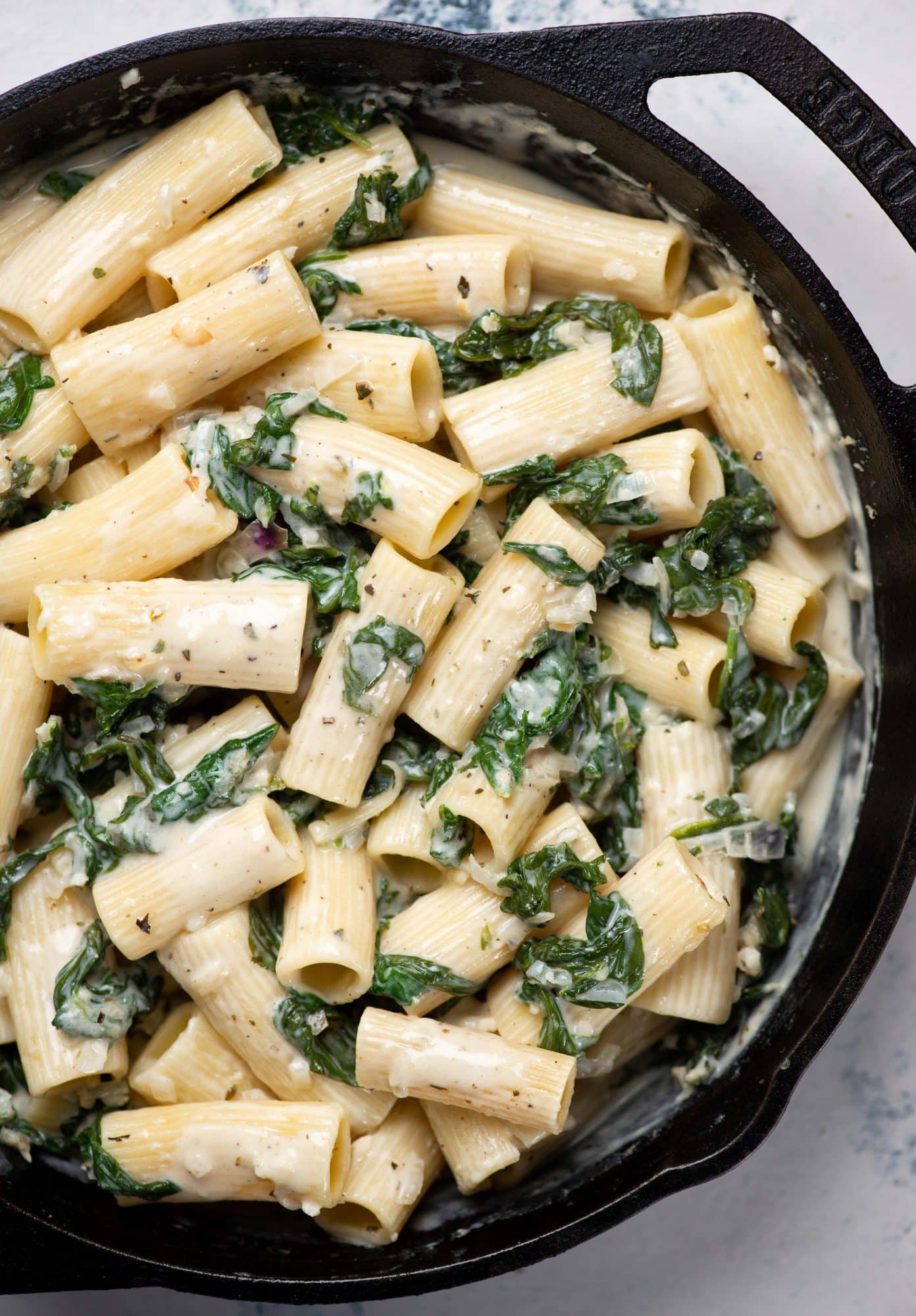 Creamy spinach pasta made in a skillet.