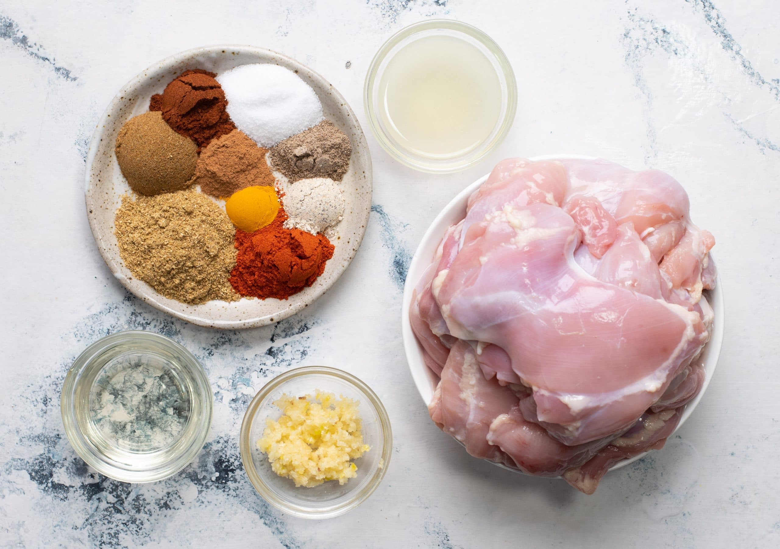 Ingredients required to marinated chicken to make grilled chicken for chicken shawarma.
