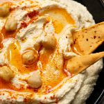 Close up view of creamy and healthy homemade hummus