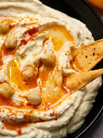 Close up view of creamy and healthy homemade hummus