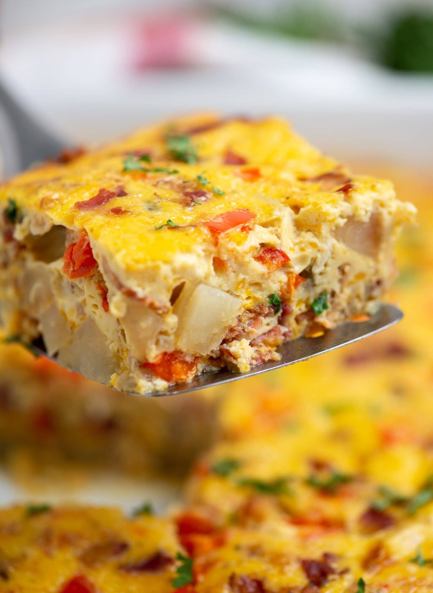 This delicious and filling Potato Casserole is made with eggs, cheese and Bacon. Perfect make-ahead breakfast and can easily feed a crowd. 

