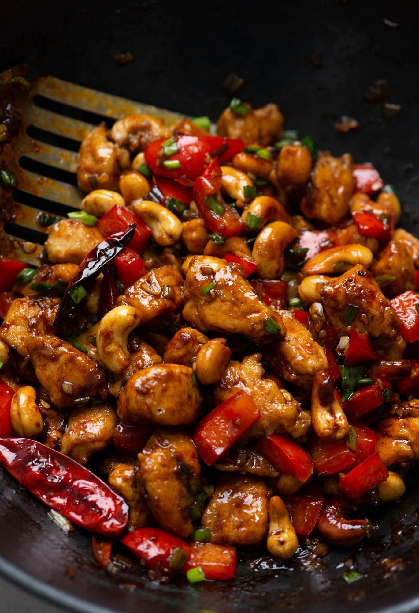 Thai Chicken Stir fry recipe is packed with thai flavors and has roasted cashews, peppers and chilies.