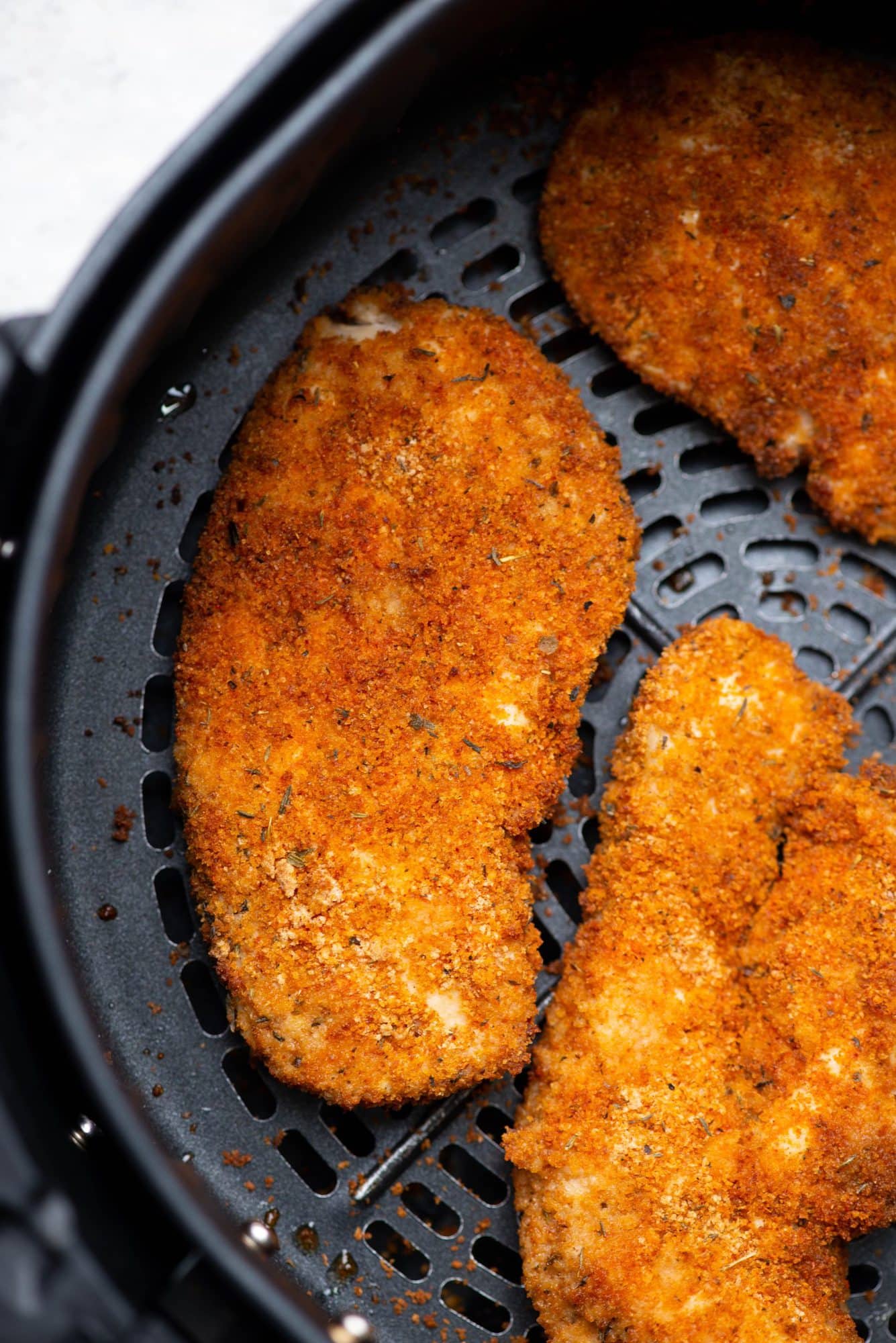 Crispy Crusty Chicken Breasts fried in an Air Fryer pan.