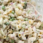 Close up of tuna pasta salad showing a creamy dressing.