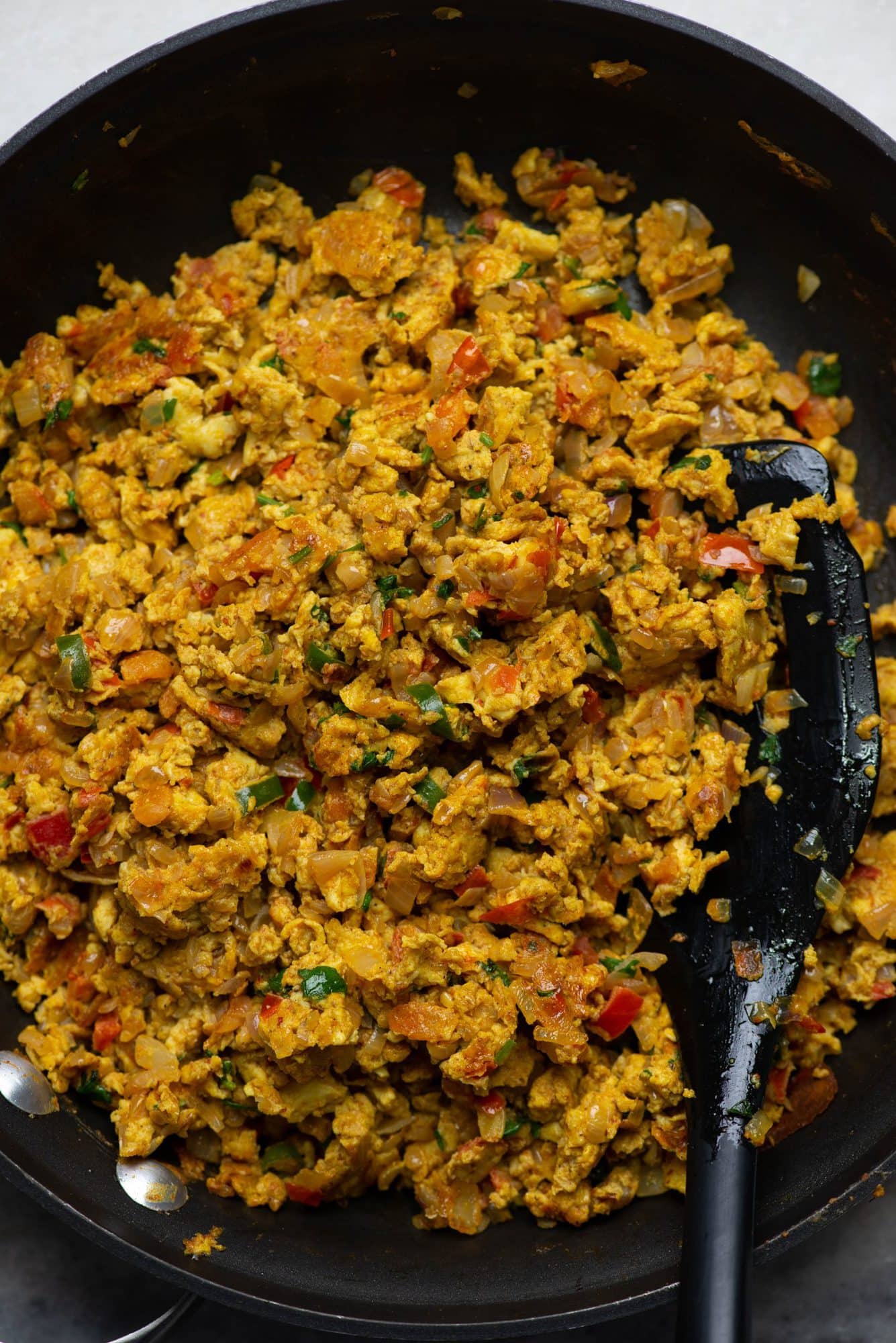 Close up image of Egg bhurji cooked in a skillet.