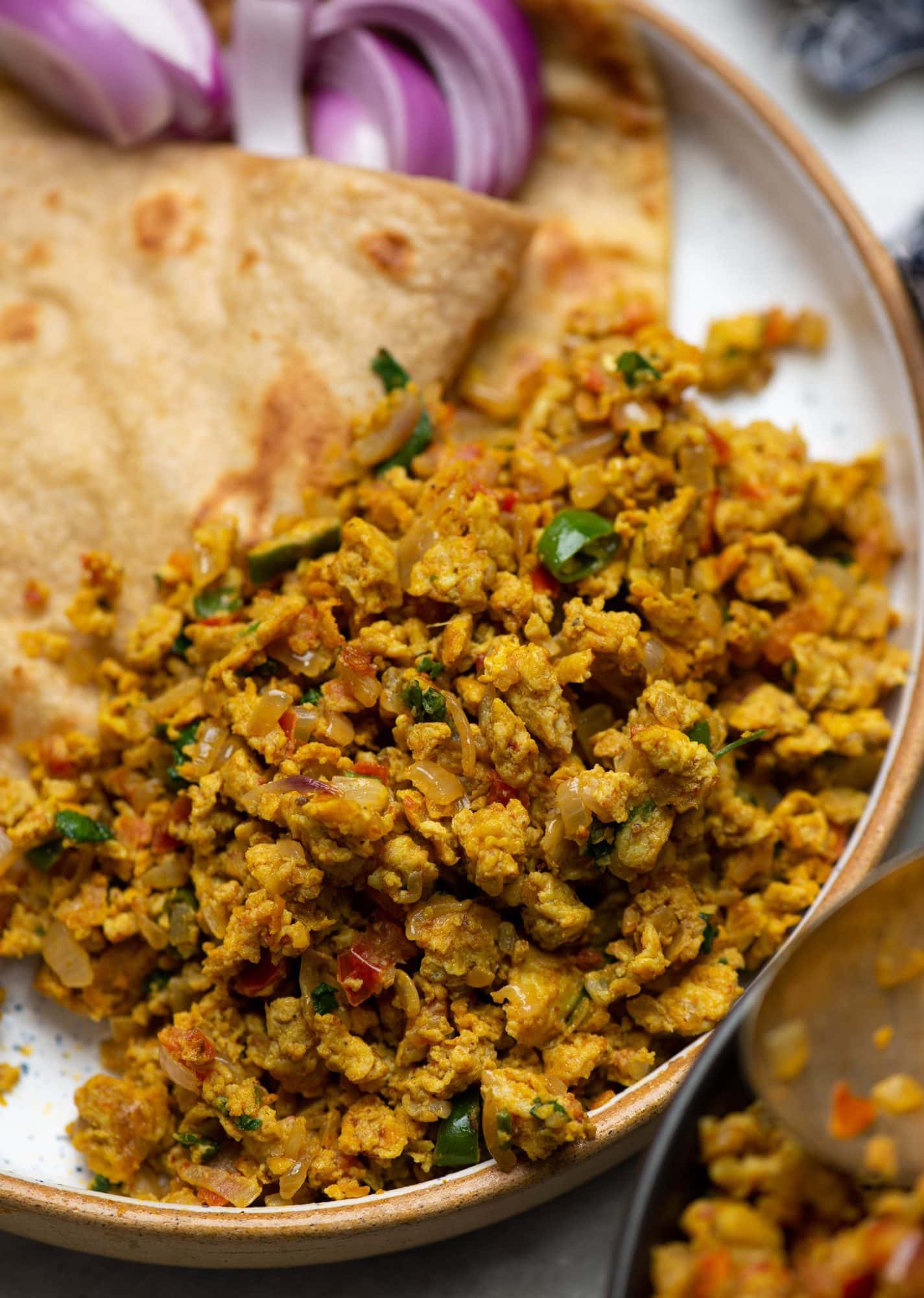 Egg bhurji or Anda bhurji served with Paratha in a plate.