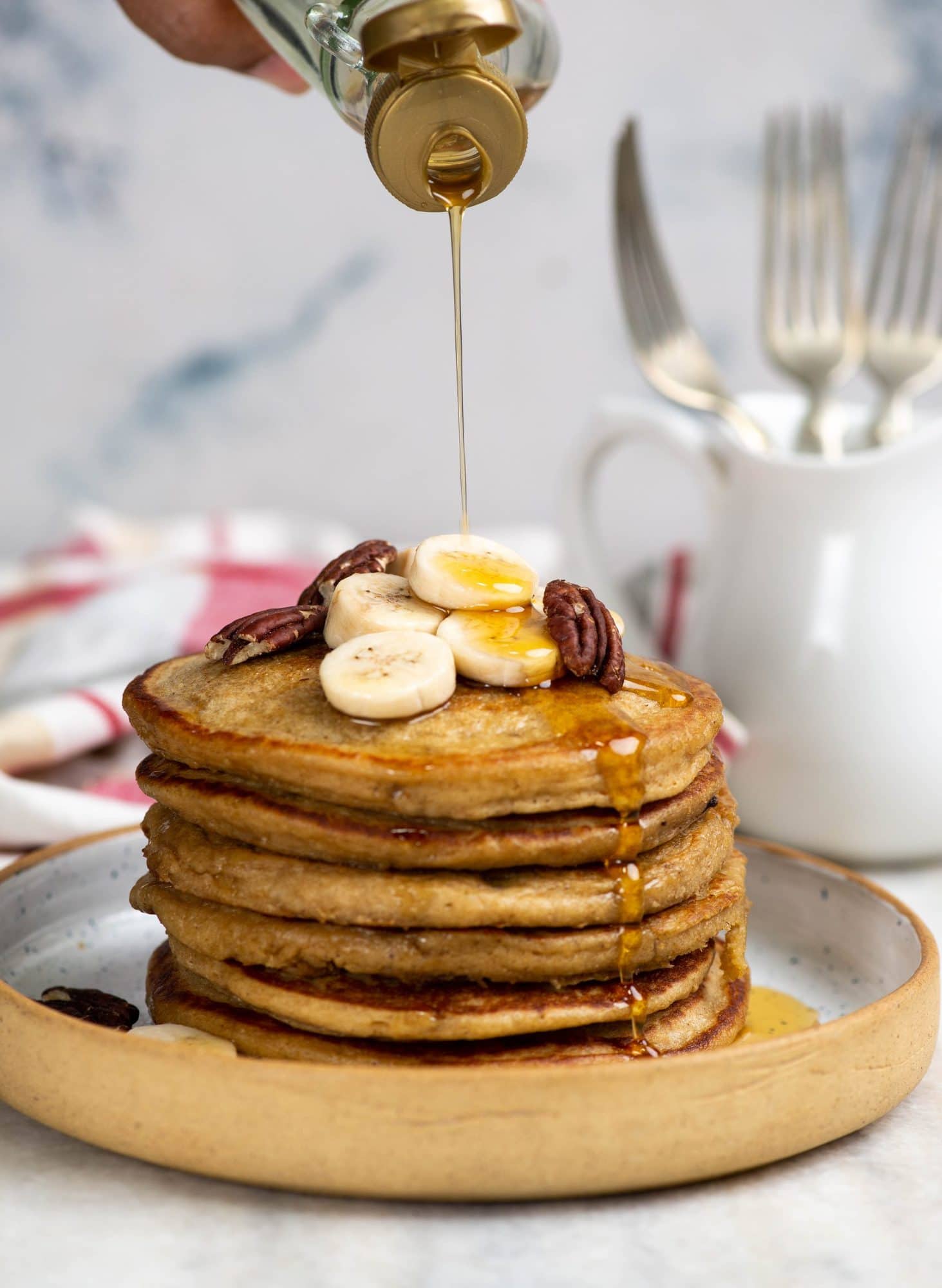 These Banana Oatmeal Pancakes are made up of whole grain(no flour), gluten-free, and really quick to make. You literally add all the ingredients to a blender and the batter is ready in 5 minutes. 
