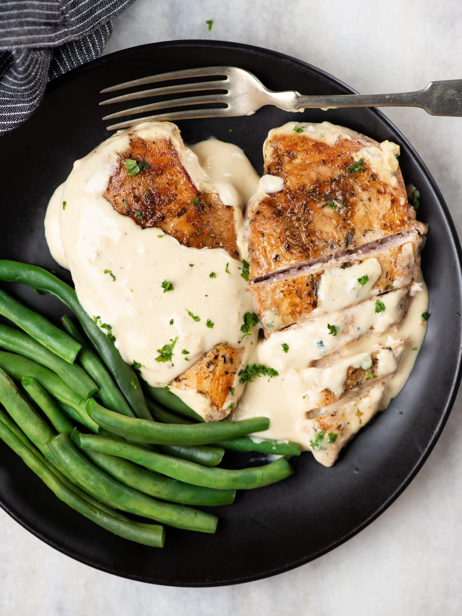 Chicken in creamy garlic parmesan Sauce, served with mashed potatoes and green beans. 