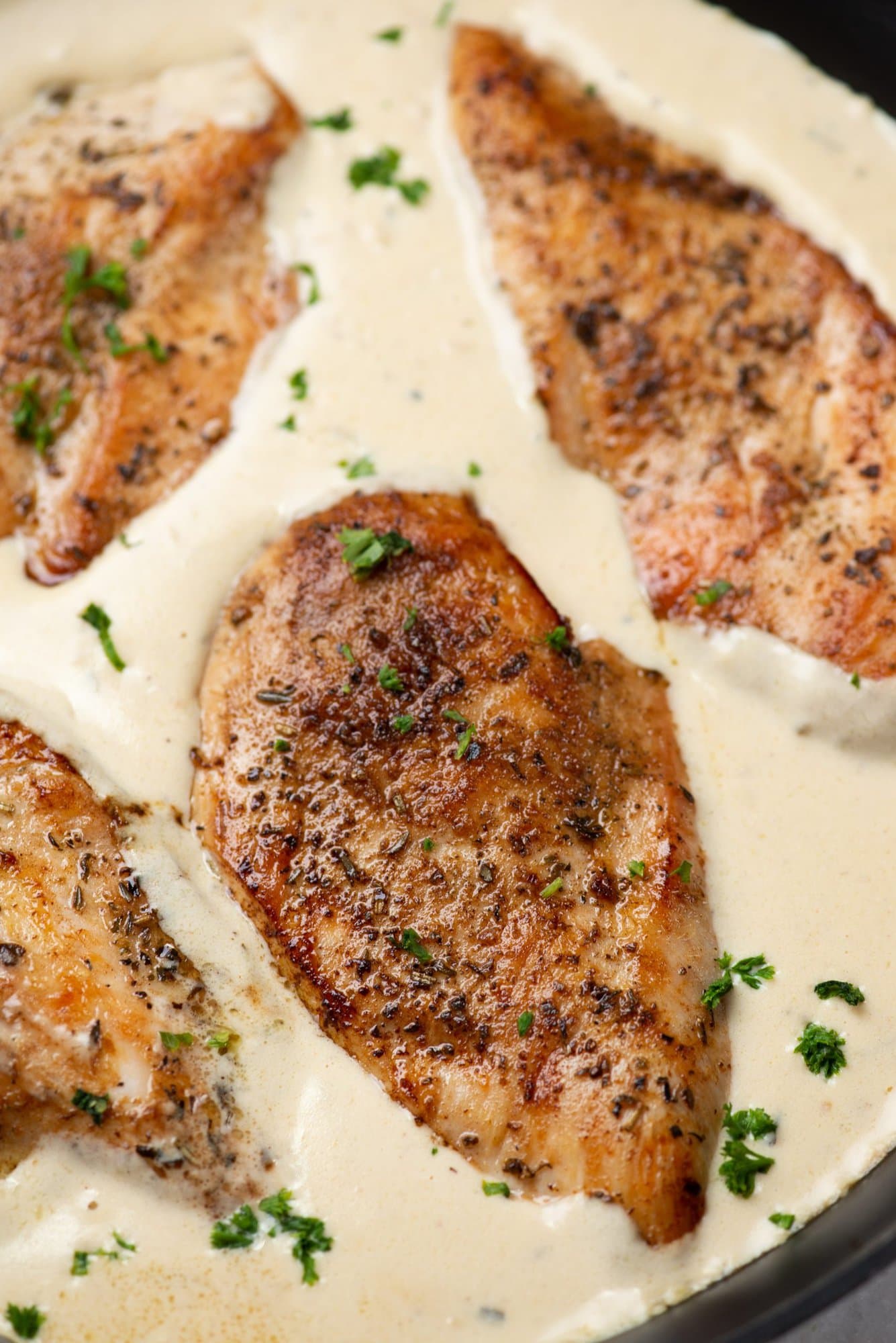 Juicy, tender, and perfectly seasoned chicken breast in a creamy garlic parmesan sauce. This one-pan chicken recipe takes less than 30 minutes to make and fits well on your weekday dinner menu.  