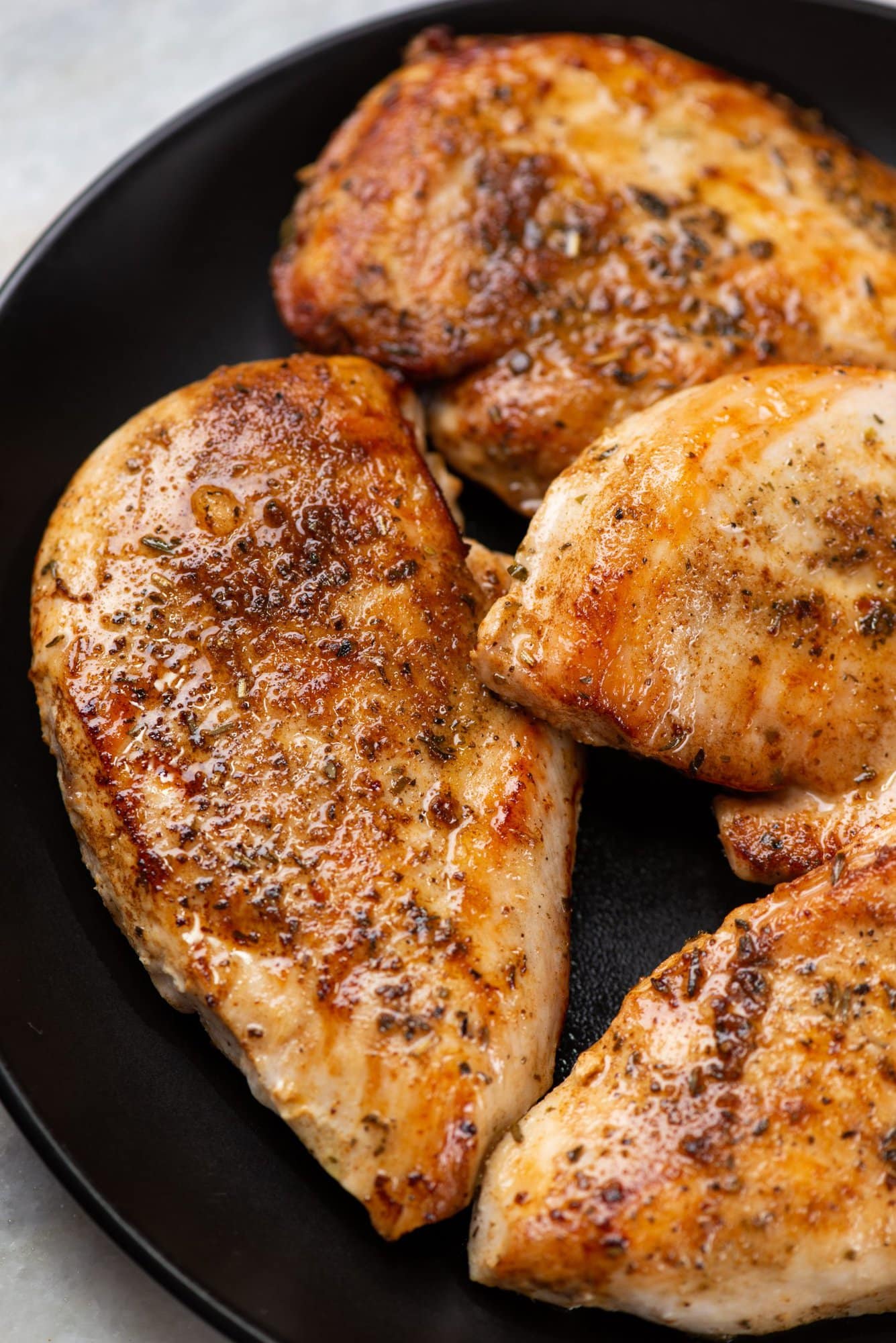Seasoned chicken breast cooked until its has golden crust, for garlic parmesan chicken. 