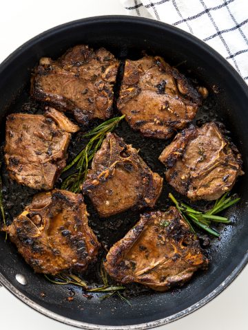 Lamb chops pan-seared and infused with mediterranean flavor from the marinade.