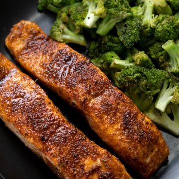 Salmon fried in an Air fryer, with tender meat, crispy skin and flavorful mix-herb seasoning.
