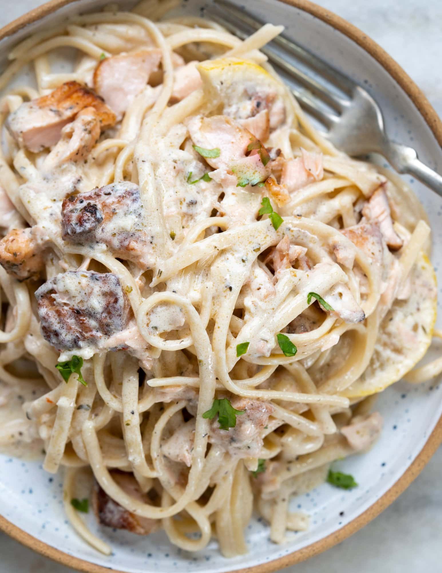 Salmon pasta with pan fried salmon and a delicous parmesan lemon cream sauce. 