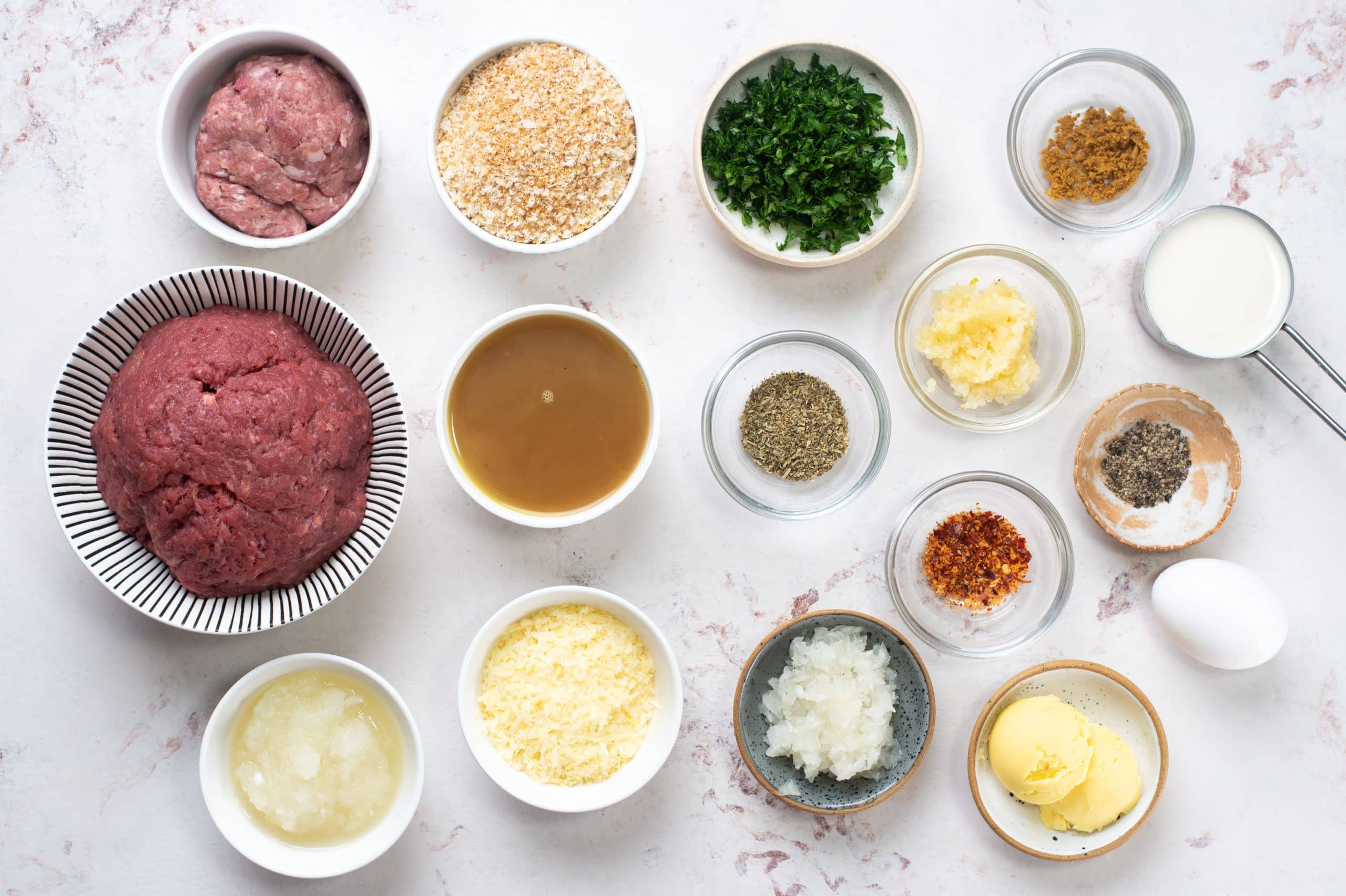 Ingredients to make soft meatballs and yum butter garlic sauce