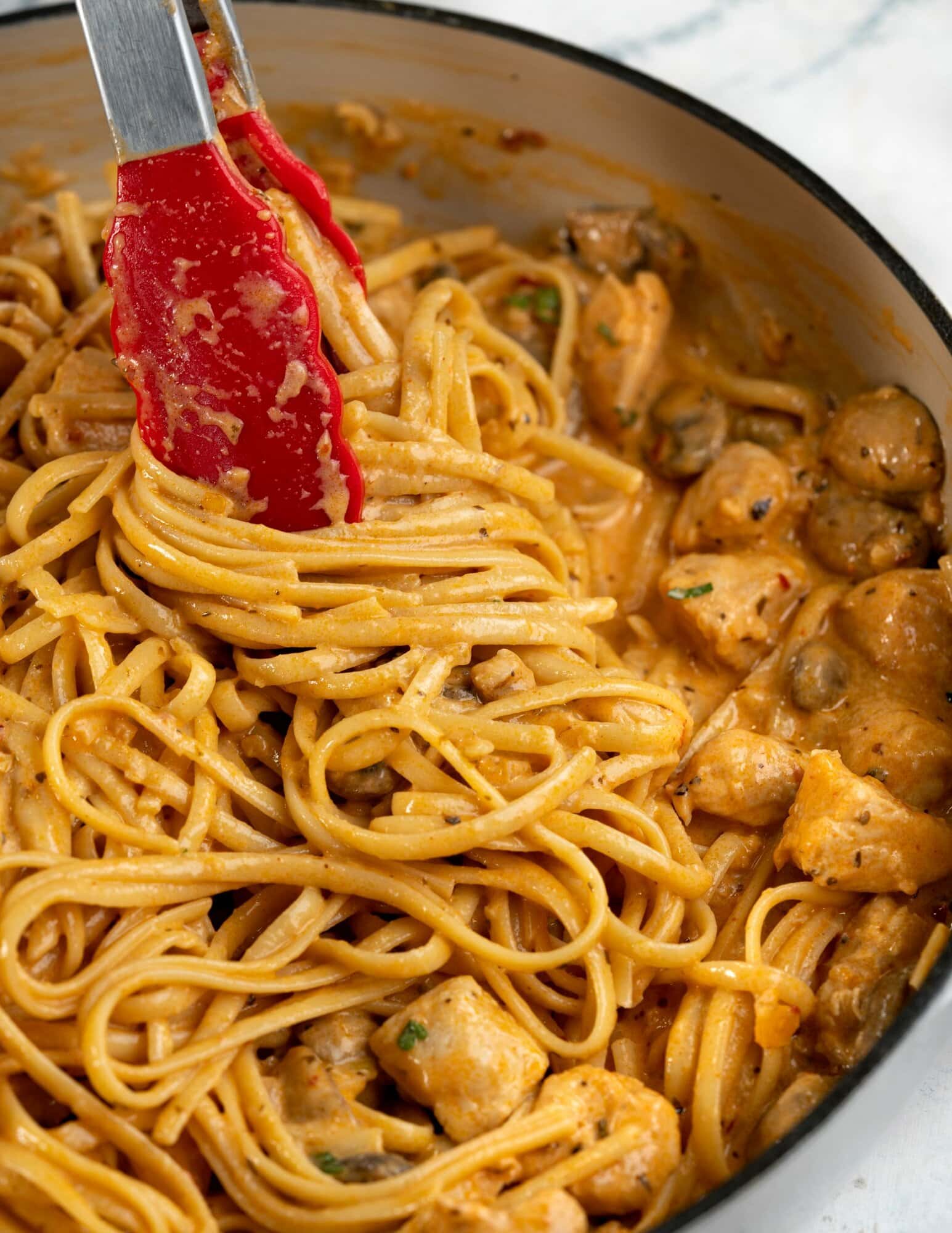 This spicy chicken pasta in a rich garlicky tomato sauce is creamy and has a perfect hint of spice. Roasted mushrooms and juicy chicken breast makes this Chicken pasta a filling meal on its own.