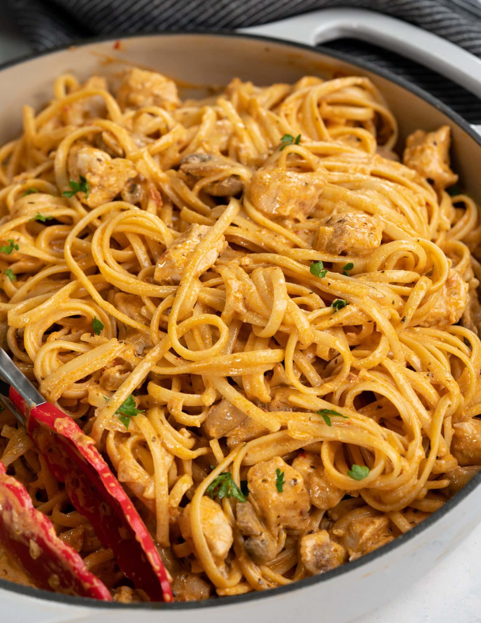 This spicy chicken pasta in a rich garlicky tomato sauce is creamy and has a perfect hint of spice. Roasted mushrooms and juicy chicken breast makes this Chicken pasta a filling meal on its own.