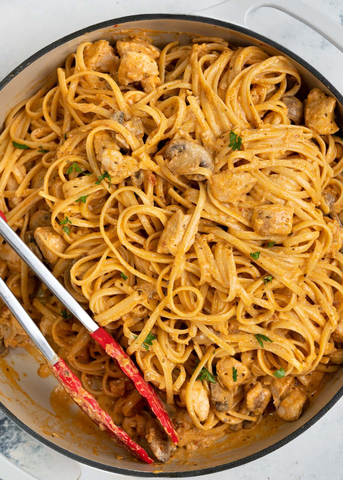 This spicy chicken pasta in a rich garlicky tomato sauce is creamy and has a perfect hint of spice. Roasted mushrooms and juicy chicken breast makes this Chicken pasta a filling meal on its own.