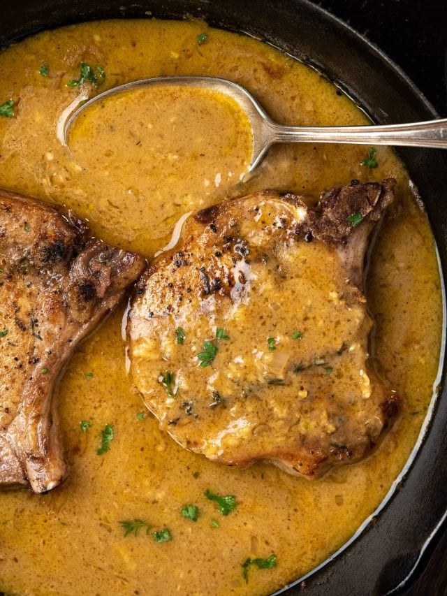 Pork chops, seared in skillet and cooked in a sour cream gravy