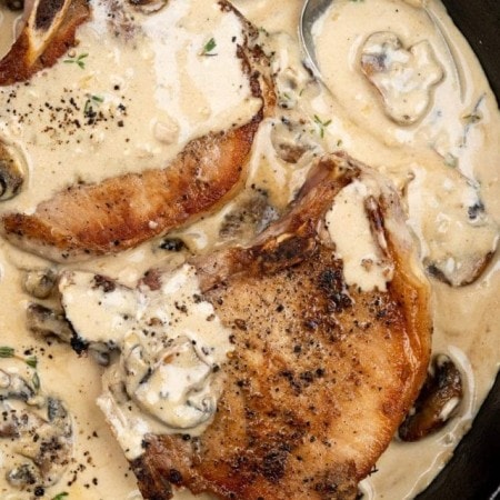 Couple of pork chops, seared to a nice crust on top and with creamy mushroom sauce.