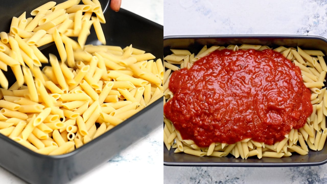uncooked pasta and the marinara sauce is spread evenly in a baking dish