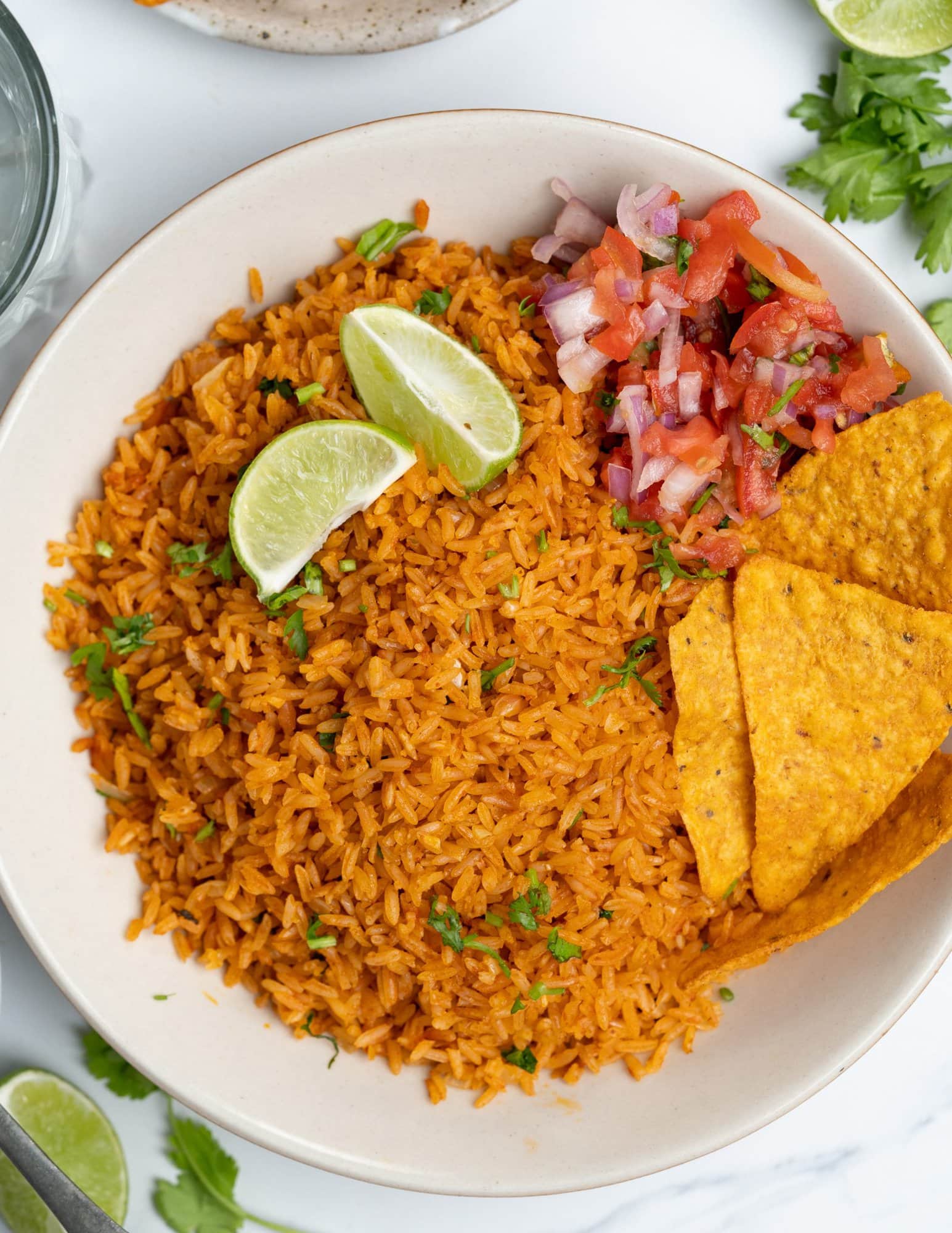 Mexican rice is packed with tomato flavor and is a perfect side dish to complete any Mexican meal. Having been cooking rice for many years, I am going to share all the tips to make this Mexican rice nice and fluffy.