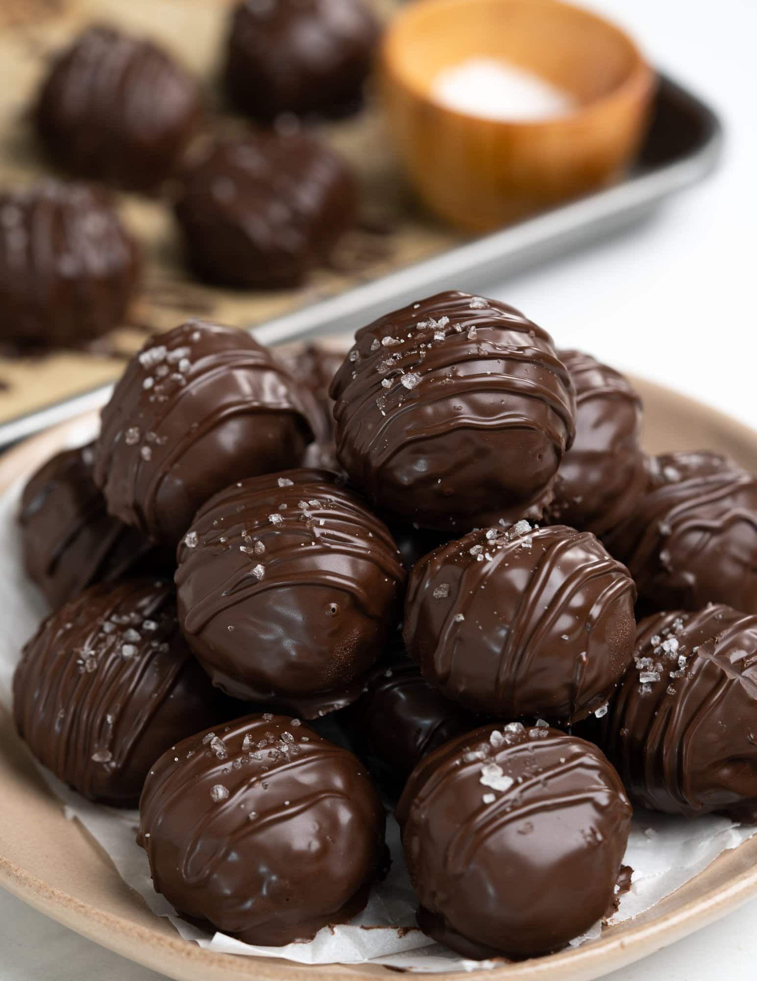 These no-bake Peanut butter balls are covered with dark chocolate and have crunch in every bite from the puffed rice cereal. Easy and fun to make peanut butter balls are perfect sweet treats for kids and adults alike. 