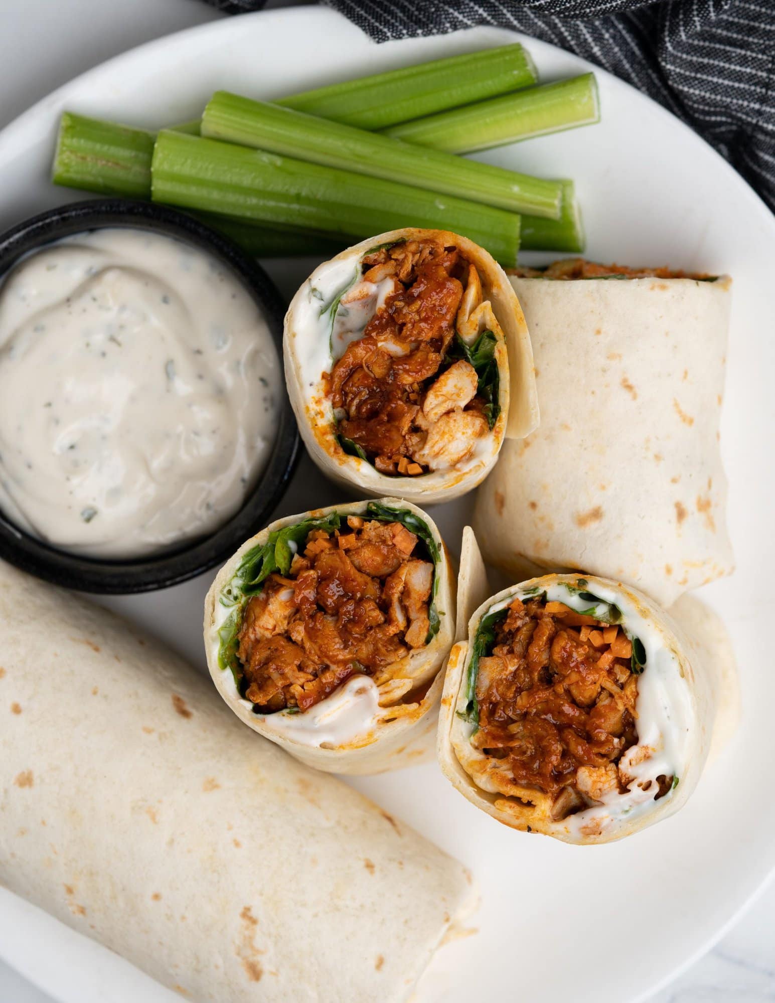 Tortilla wraps filled with juicy buffalo chicken, carrots, salad greens and then topped with creamy ranch dressing.