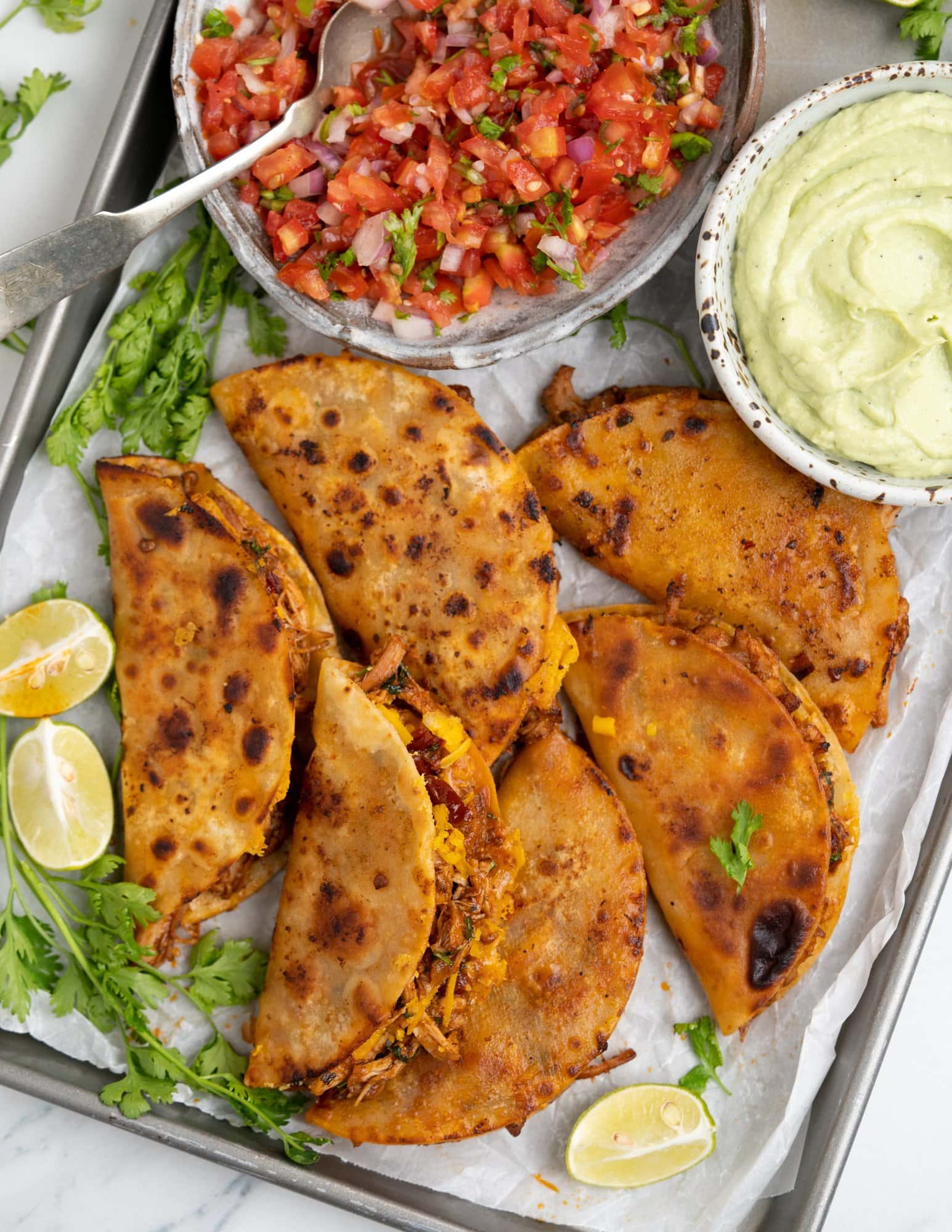 Chicken Tacos served with salsa, cilantro and avocado cream
