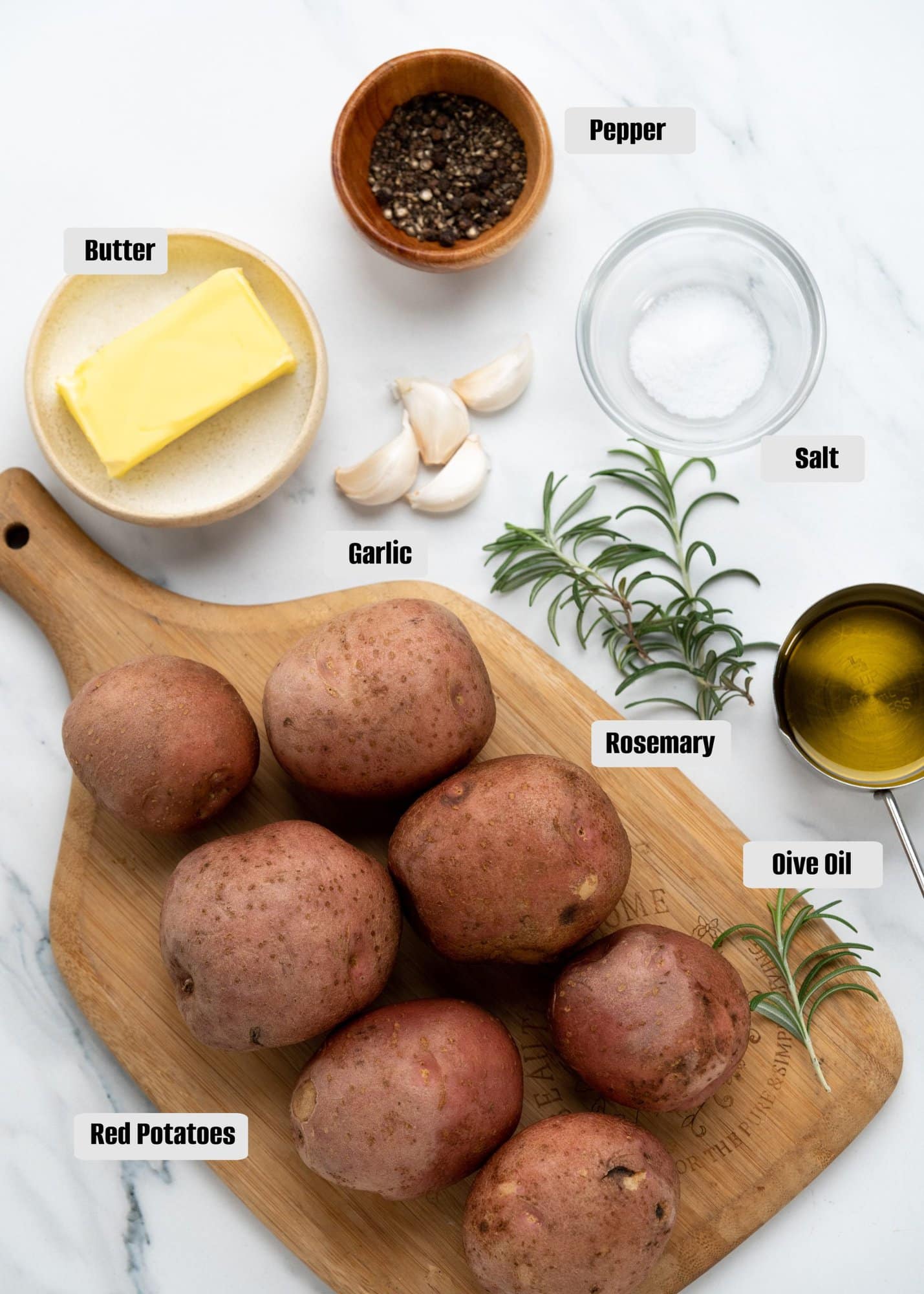 Ingredients for roasted red potatoes. Butter,pepper,garlic,salt,rosemary,olive oil,red potatoes