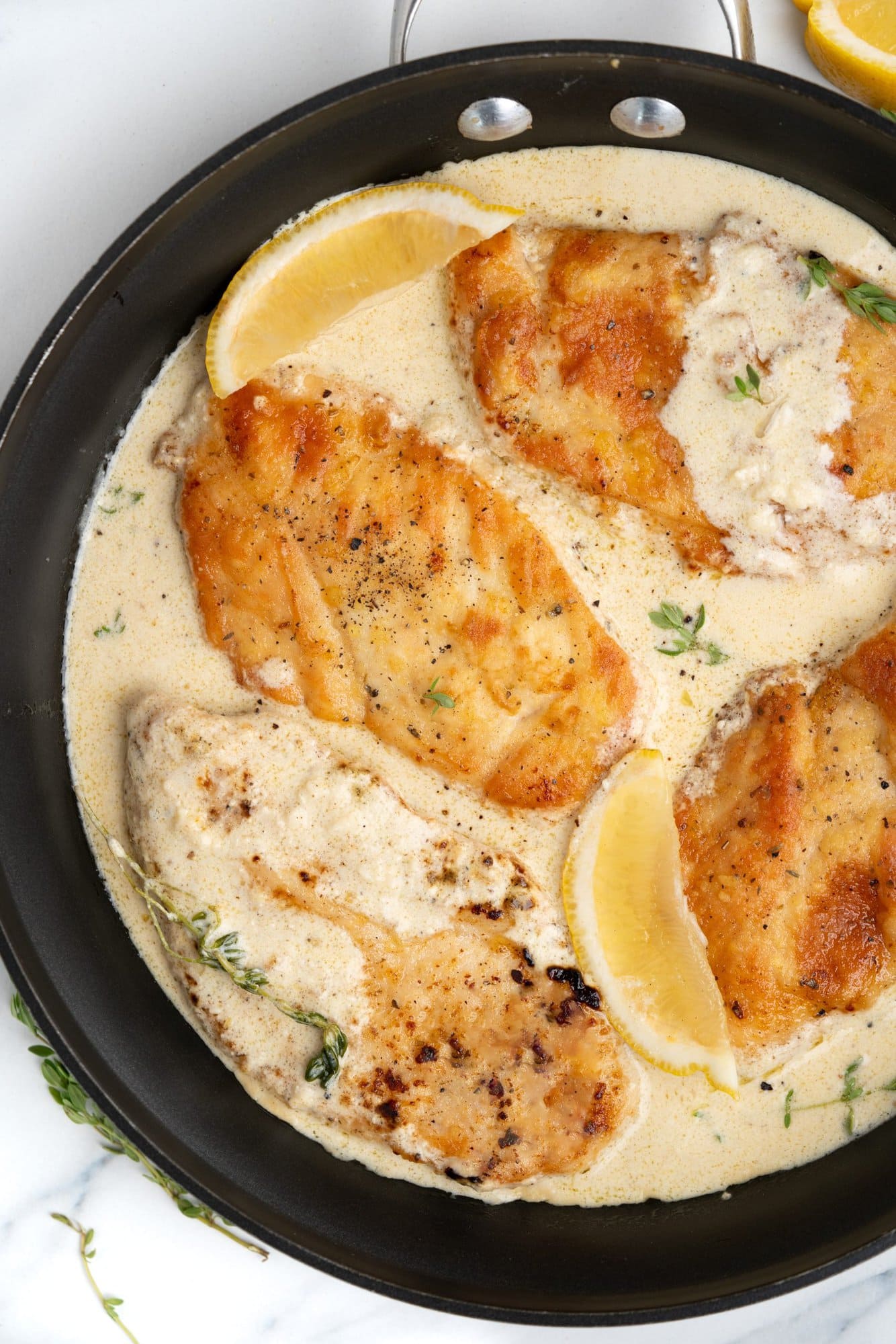 Creamy lemon chicken has crispy pan-fried chicken breast topped with a luscious lemon cream sauce. 