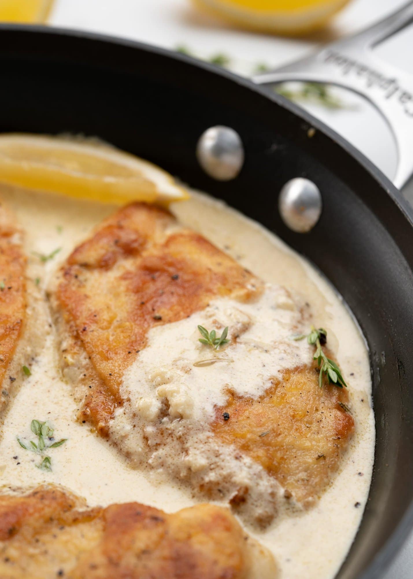 Crispy chicken breast topped with creamy lemon sauce.