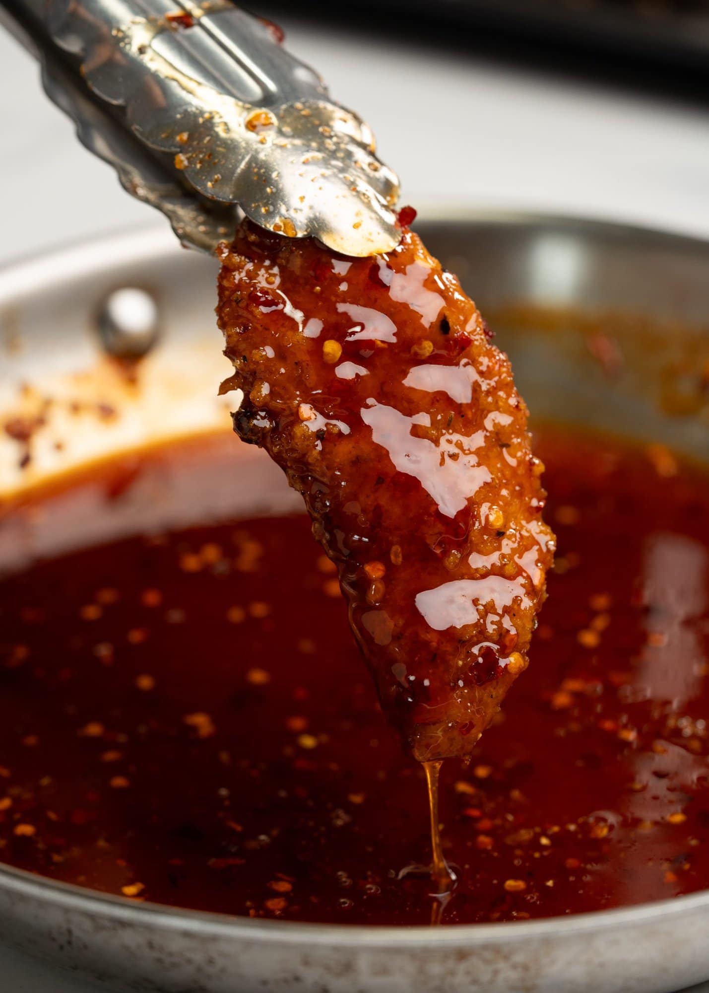 Crispy chicken tender glazed with hot honey sauce.