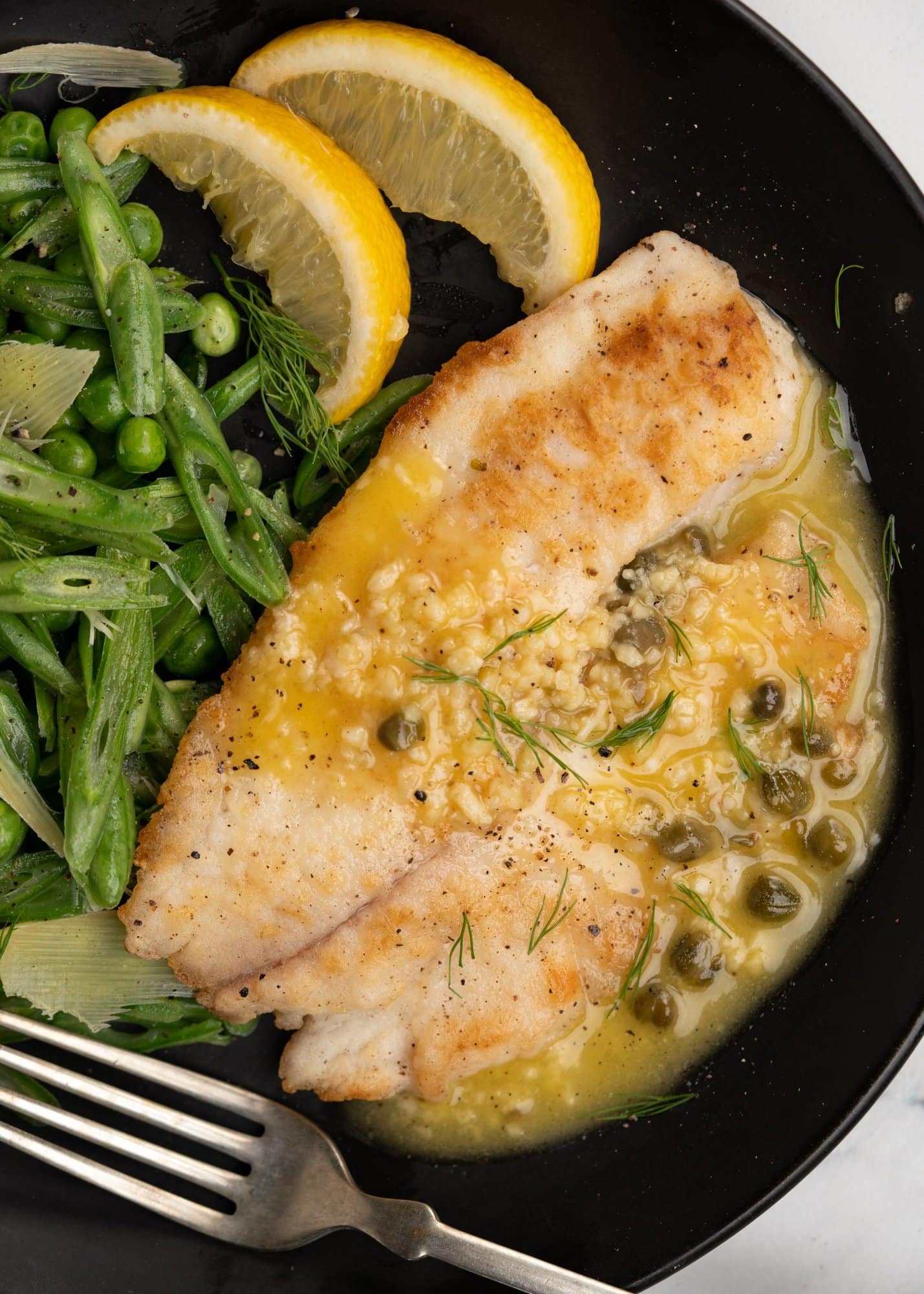 Crispy Pan-fried Tilapia is served with a decadent Lemon Caper sauce. This Tilapia recipe has a bright fresh flavor and just hits the spot. You need less than 20 minutes to make this restaurant-worthy meal at home. 
