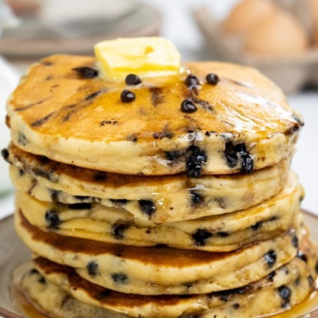 Chocolate chip pancakes with butter.