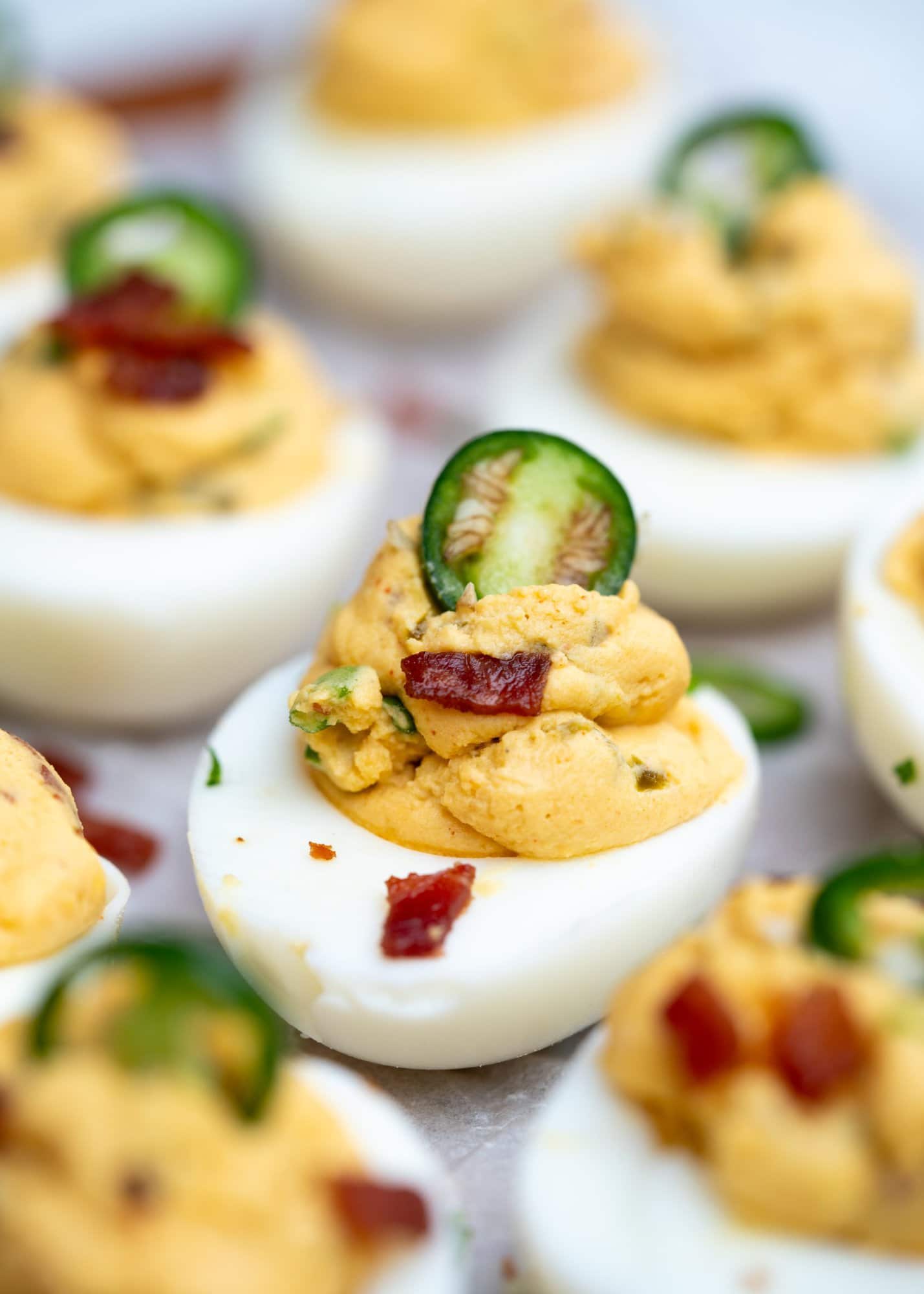 Jalapeno and bacon come together to make this classic appetizer more interesting. This variation has a fresh and spicy kick from fresh and pickled jalapenos, with the bacon adding saltiness and a layer of flavor.