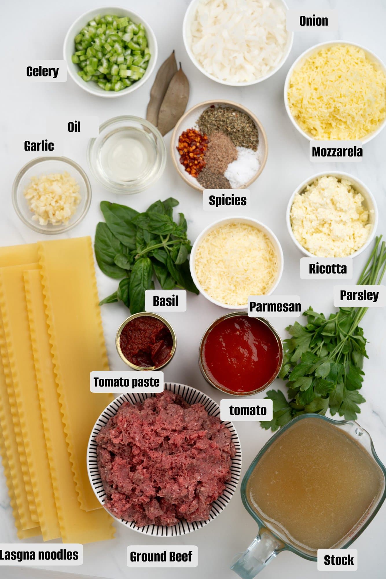 Ingredients for Lasagna Soup - Ground beef, Dried noodles, crushed tomatoes, tomato paste, onion, celery, garlic, chicken stock, seasoning, ricotta , parmesan, Mozzarela, basil and parsley . 