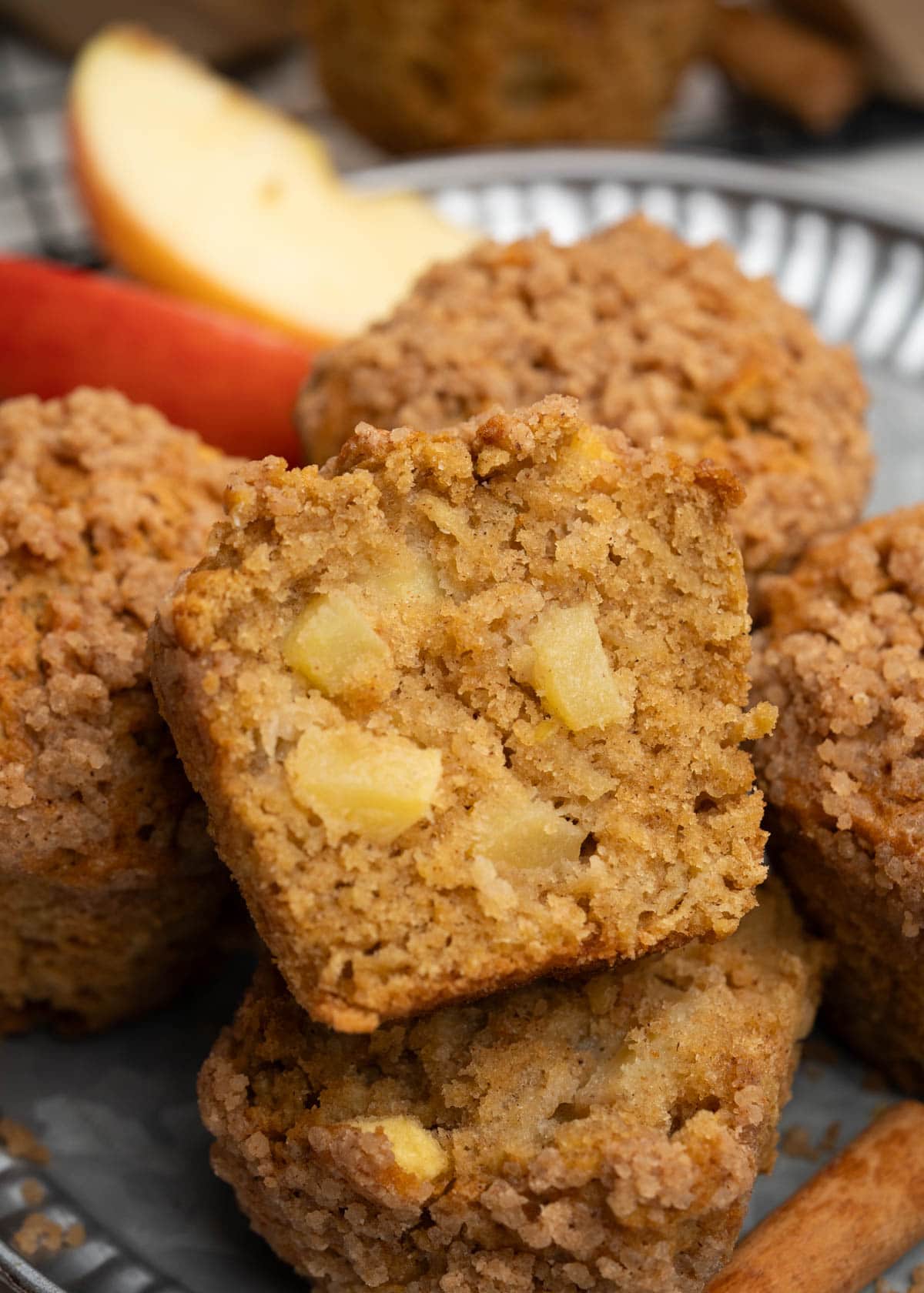 Cross section of apple muffins showing chunks of apple and moist tender crumbs