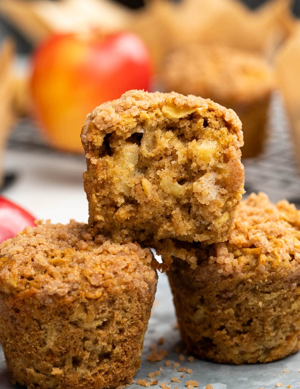 Cross section of apple muffins showing chunks of apple and moist tender crumbs