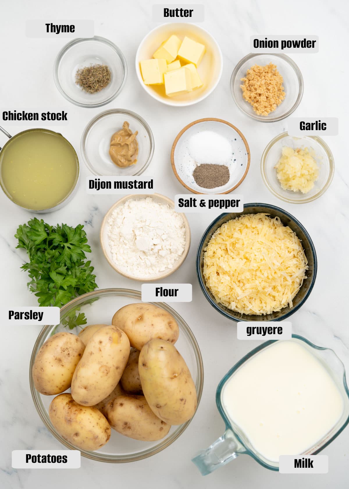 Ingredients needed to make creamy and cheesy scalloped potatoes. Add breadcrumbs and more cheese to get potato au gratin too.