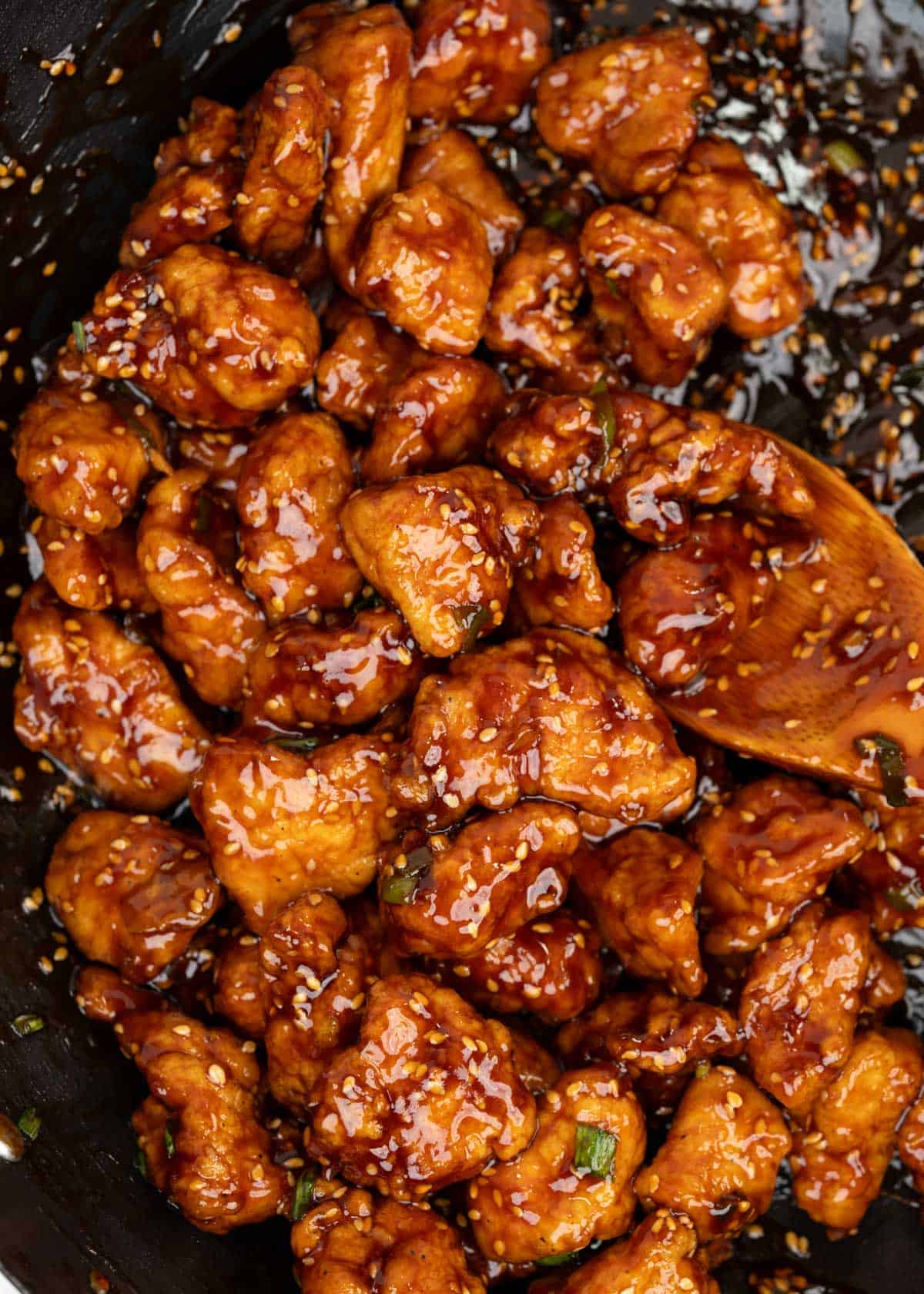 Honey sesame chicken in a wok