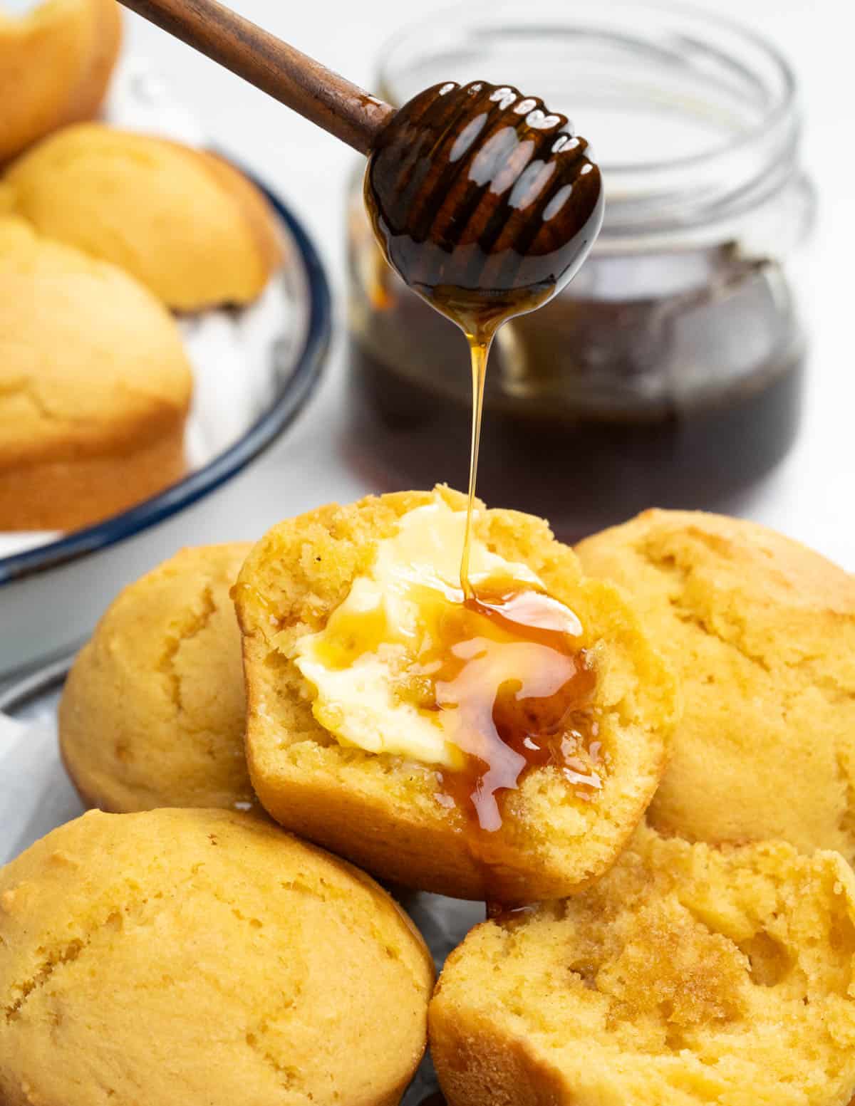 These Cornbread muffins are delicious with moist tender crumbs. These are savory with just a little hint of sugar. Served with butter and drizzle of honey