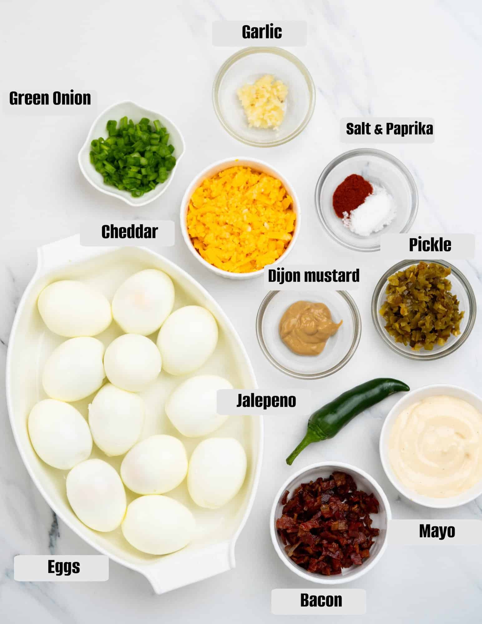 Ingredients images shows all the ingredients measured and shown to make jalapeno deviled eggs.