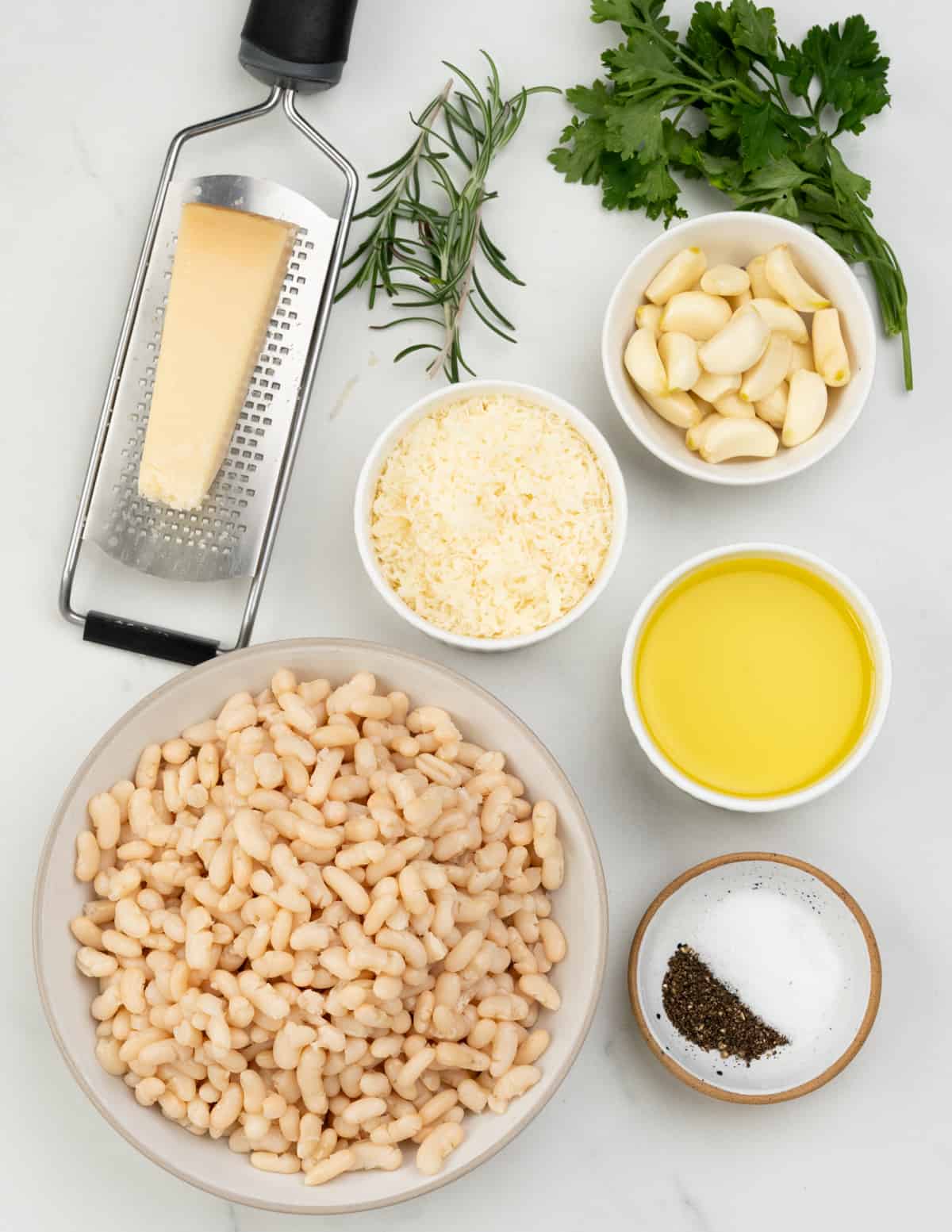 White bean dip - Ingredients Image - Cannellini beans, garlic, rosemary, parmesan, olive oil, salt and pepper.