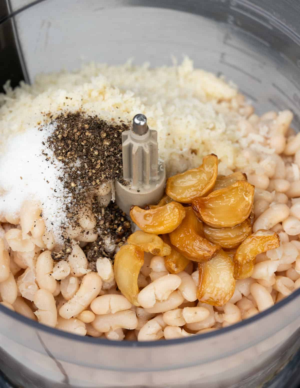 All ingredients for white bean dip placed in blender.