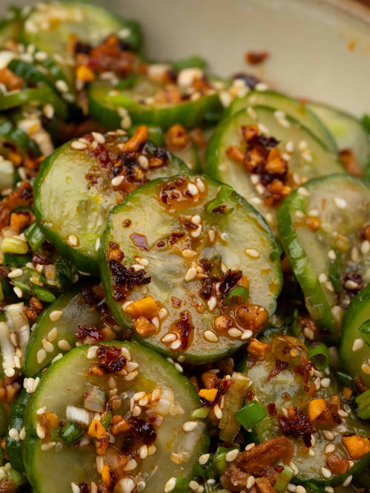 Sliced cucumbers, green onion tossed in a Asian inspired dressing, chilli crisp and toasted sesame seeds.