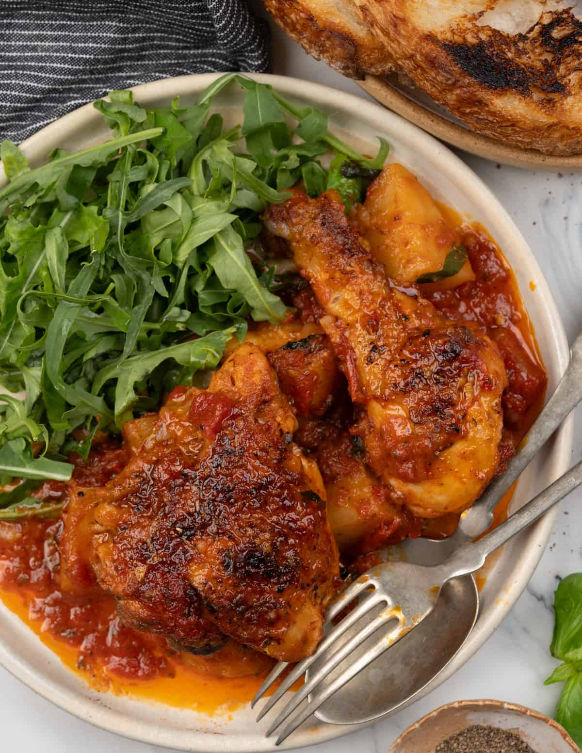 Italian baked chicken and potatoes served with arugula salad. 