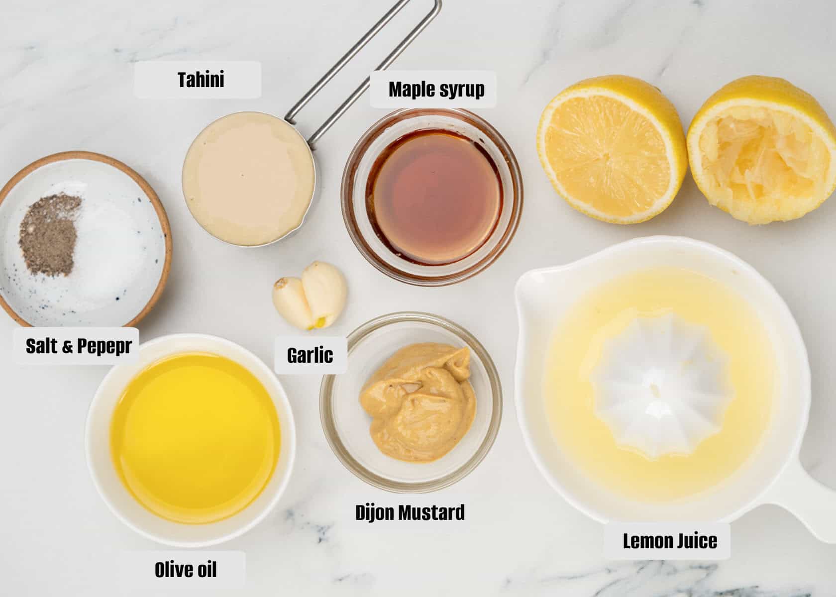Ingredients for creamy lemon tahini dressing.